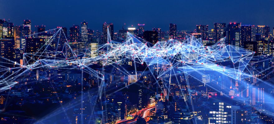 City skyline at night with interconnecting points