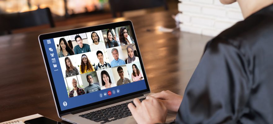 Woman on video call with colleagues