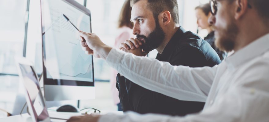 Men working on a computer