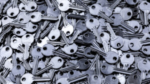 Many silver keys in a pile